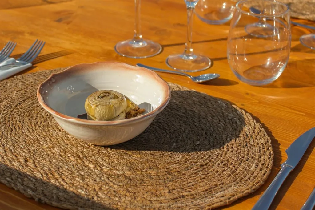 Artichoke confit on a handmade ceramic plate